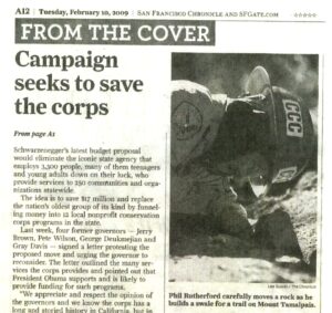 Photo of news clipping from the San Francisco Chronicle, headline reads "Campaign seeks to save the corps"