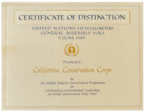 Scanned image, reads Certificate of Distinction, United Nations Headquarters, General Assembly Hall, 5 June 1985, Prested to California Conservation Corps by the United National Environment Programme for outstanding environmental leadership on World Environment Day 1985